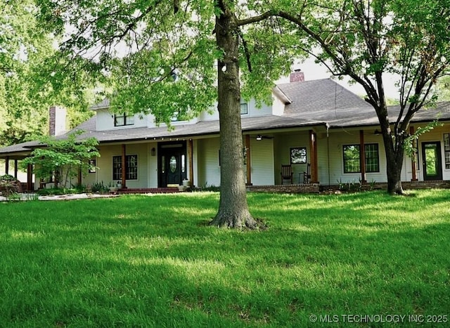 15373 N Javine Hill Rd, Skiatook, OK 74070 - view of front facade featuring a chimney, covered porch, and a front lawn