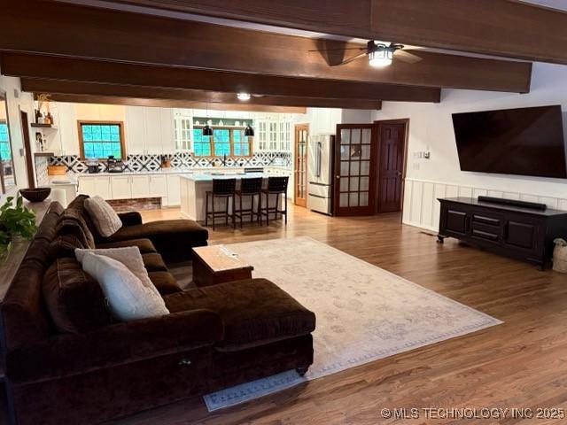 15373 N Javine Hill Rd, Skiatook, OK 74070 - living area with ceiling fan, beam ceiling, and wood finished floors