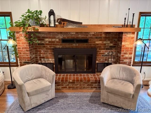 15373 N Javine Hill Rd, Skiatook, OK 74070 - living area featuring a fireplace, healthy amount of natural light, and wood finished floors