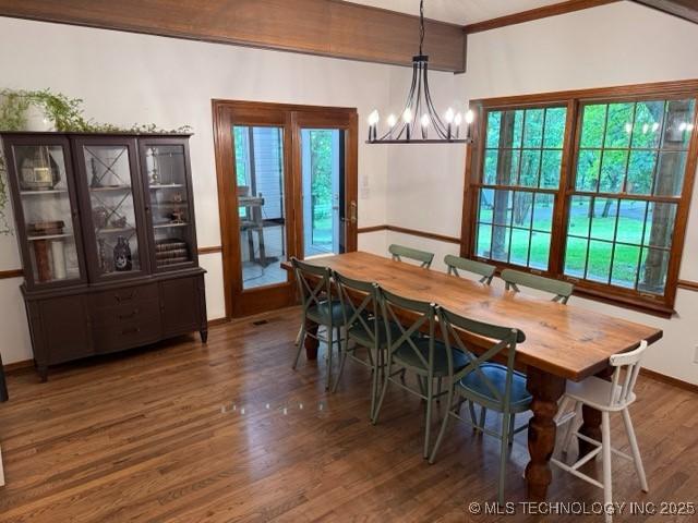 15373 N Javine Hill Rd, Skiatook, OK 74070 - dining room featuring wood finished floors, a chandelier, and baseboards