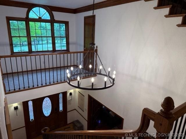 15373 N Javine Hill Rd, Skiatook, OK 74070 - stairs with a chandelier and ornamental molding