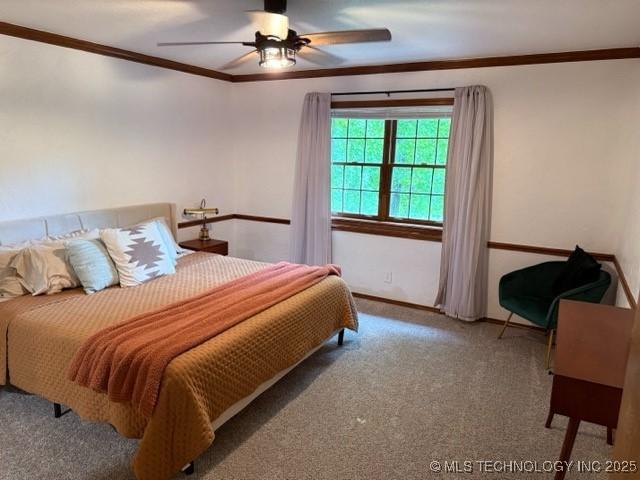 15373 N Javine Hill Rd, Skiatook, OK 74070 - carpeted bedroom with ornamental molding, ceiling fan, and baseboards