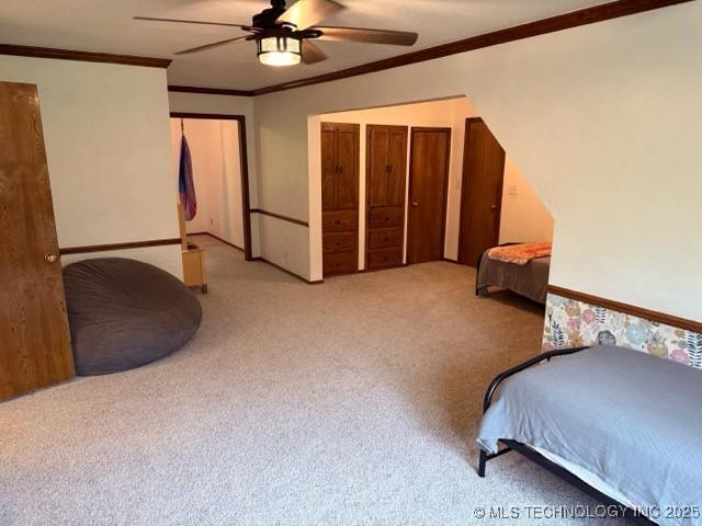 15373 N Javine Hill Rd, Skiatook, OK 74070 - bedroom featuring carpet floors, crown molding, ceiling fan, and baseboards