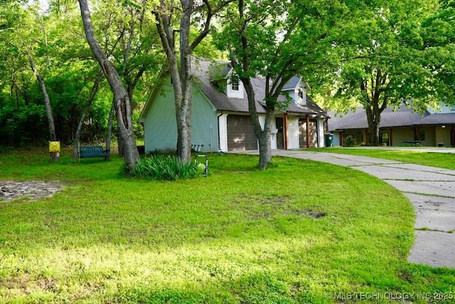 15373 N Javine Hill Rd, Skiatook, OK 74070 - cape cod home with concrete driveway and a front yard