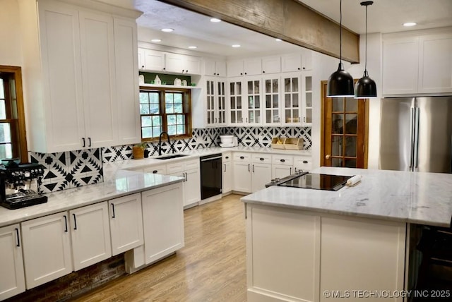 15373 N Javine Hill Rd, Skiatook, OK 74070 - kitchen with black appliances, tasteful backsplash, light stone countertops, light wood-type flooring, and recessed lighting