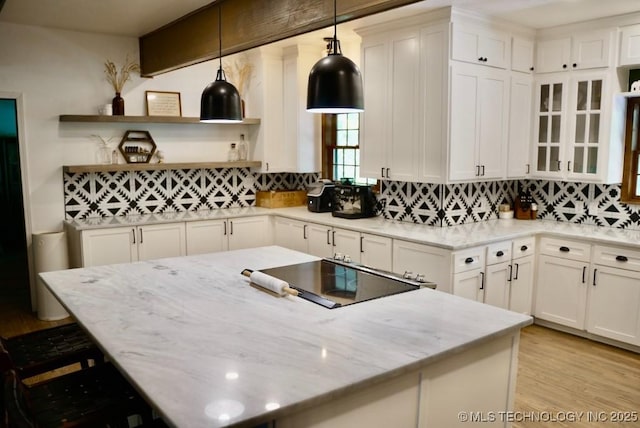15373 N Javine Hill Rd, Skiatook, OK 74070 - kitchen featuring backsplash, a kitchen island, and open shelves
