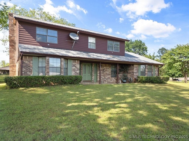 311 Washington Ave, Boswell, OK 74727 - view of front of home featuring a front yard, a chimney, and brick siding