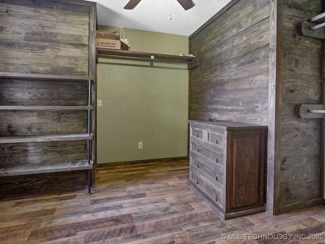 311 Washington Ave, Boswell, OK 74727 - walk in closet featuring a ceiling fan and wood finished floors