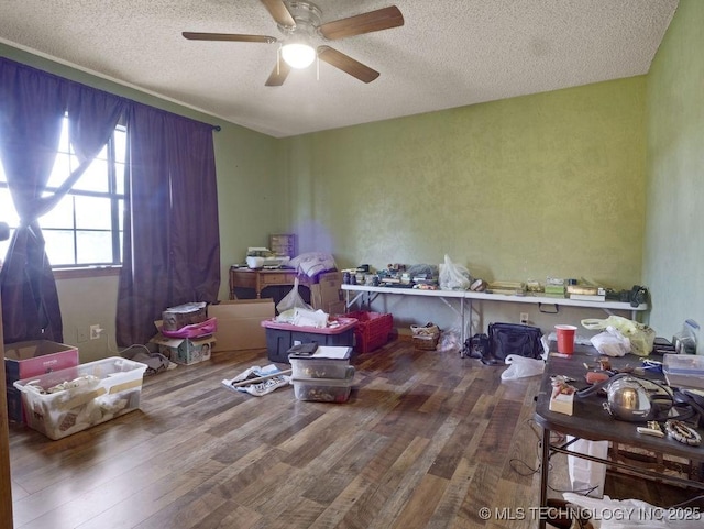 311 Washington Ave, Boswell, OK 74727 - misc room featuring wood finished floors, a textured ceiling, and a ceiling fan
