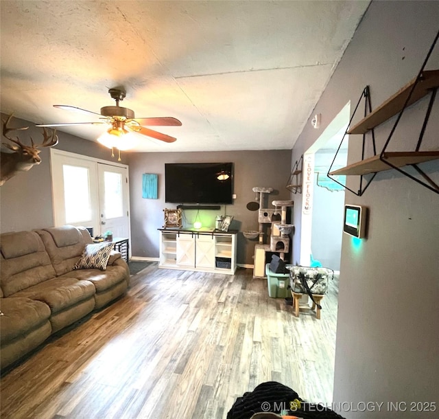 1715 Worley, Durant, OK 74701 - living room with a ceiling fan, wood finished floors, french doors, and baseboards