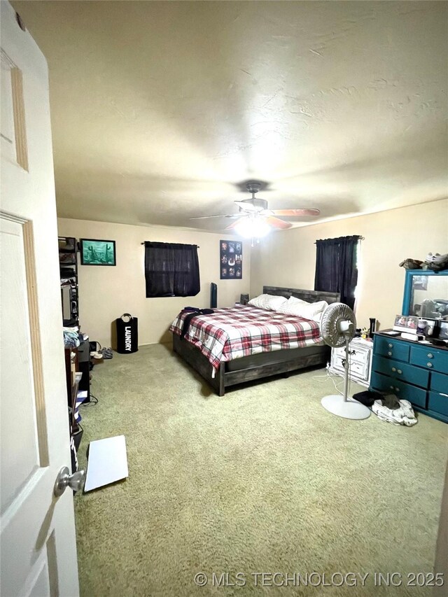1715 Worley, Durant, OK 74701 - carpeted bedroom with a ceiling fan
