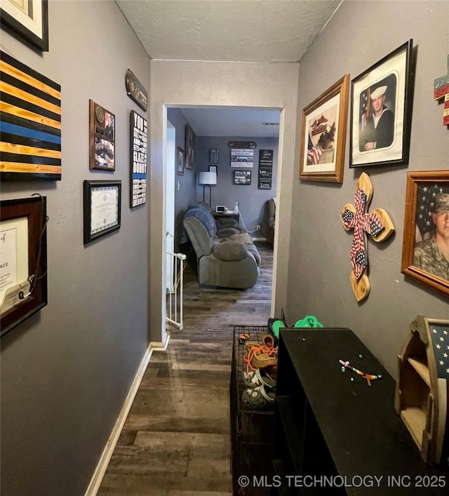 1715 Worley, Durant, OK 74701 - hall featuring wood finished floors and baseboards