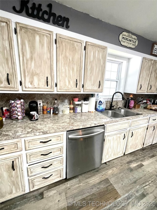 1715 Worley, Durant, OK 74701 - kitchen with dishwasher, a sink, light brown cabinets, light countertops, and dark wood-style flooring