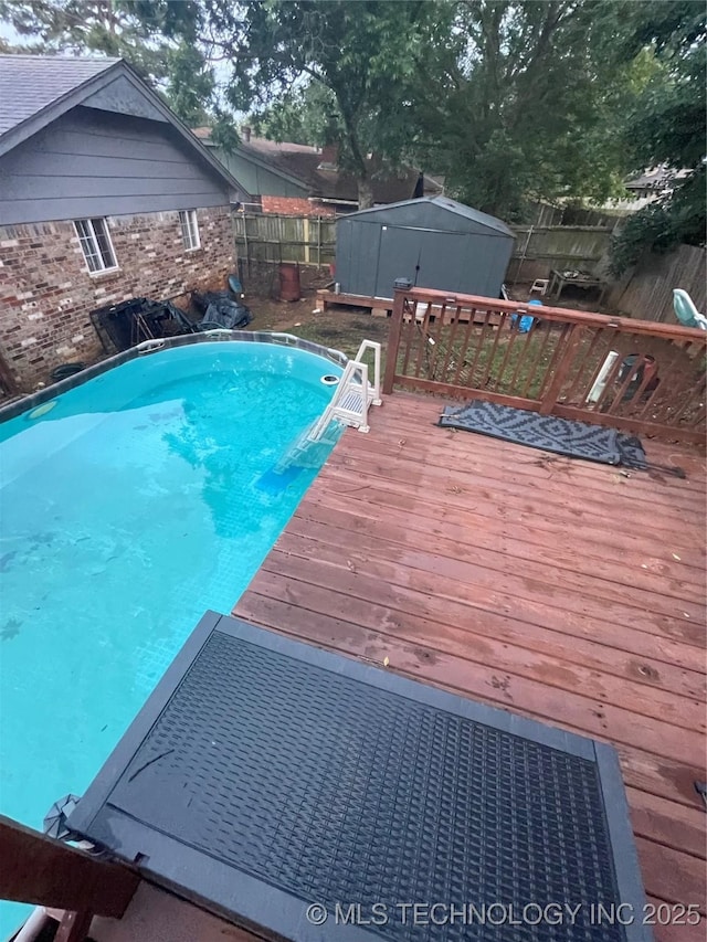 1715 Worley, Durant, OK 74701 - view of pool with a wooden deck and a fenced backyard