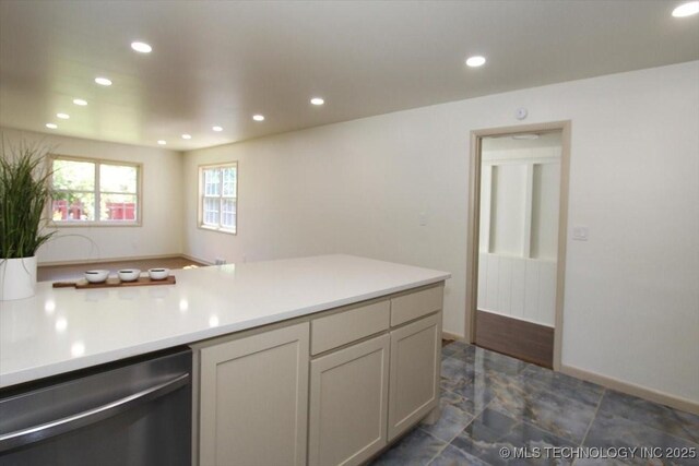 6112 E 21st St, Tulsa, OK 74114 - kitchen featuring dishwasher, recessed lighting, light countertops, dark marble finish floors, and baseboards