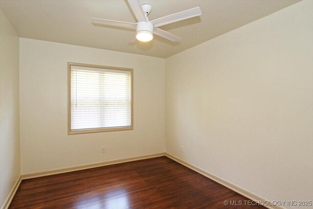6112 E 21st St, Tulsa, OK 74114 - spare room featuring dark wood-type flooring, baseboards, and ceiling fan