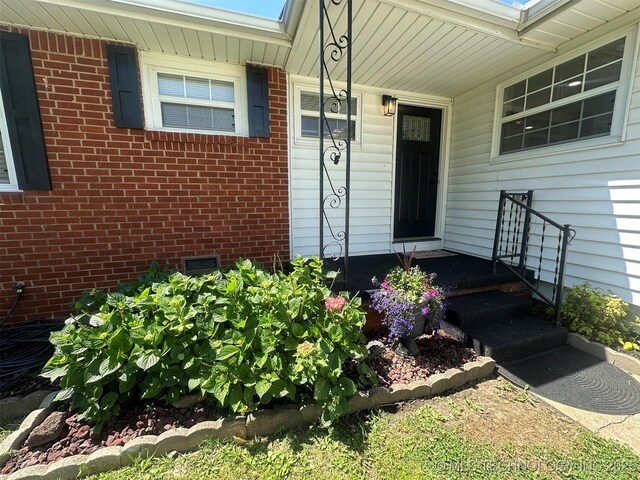 6112 E 21st St, Tulsa, OK 74114 - entrance to property featuring brick siding