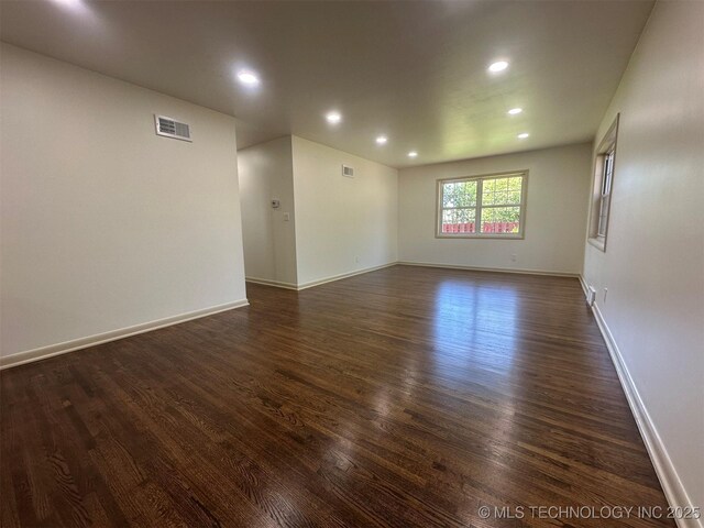6112 E 21st St, Tulsa, OK 74114 - unfurnished room with dark wood-style floors, recessed lighting, and baseboards