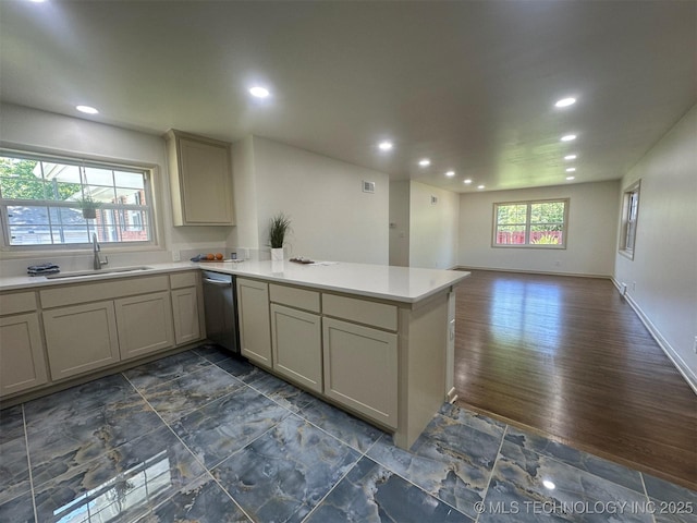 6112 E 21st St, Tulsa, OK 74114 - kitchen with a sink, a peninsula, recessed lighting, dishwasher, and light countertops