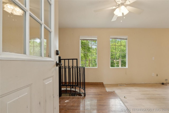 1403 Vale, Grove, OK 74344 - stairway featuring hardwood / wood-style flooring and ceiling fan