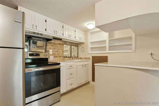1403 Vale, Grove, OK 74344 - kitchen with appliances with stainless steel finishes, under cabinet range hood, white cabinets, open shelves, and light countertops
