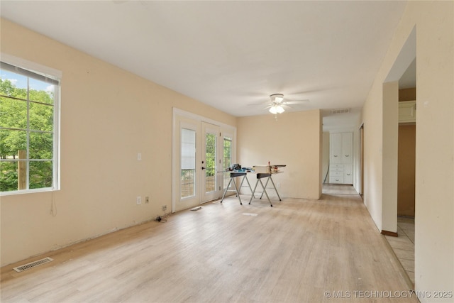 1403 Vale, Grove, OK 74344 - unfurnished room featuring light wood-type flooring, french doors, and plenty of natural light