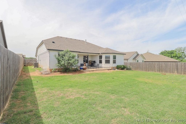 rear view of property featuring central AC unit and a patio area