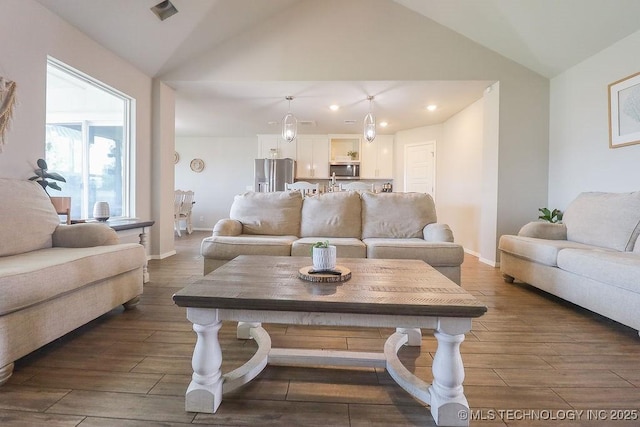 living room featuring vaulted ceiling, dark wood-style floors, recessed lighting, and baseboards