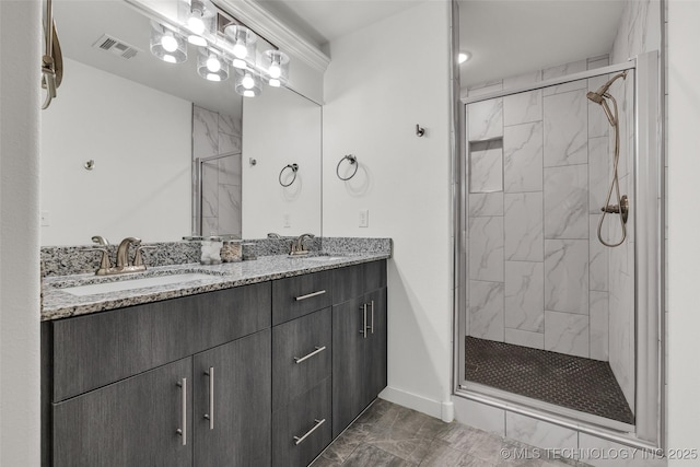 2621 S Catalayah Ln, Claremore, OK 74019 - full bath featuring a shower stall, double vanity, baseboards, and marble finish flooring