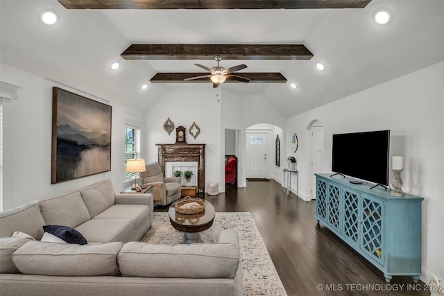 2621 S Catalayah Ln, Claremore, OK 74019 - living area with arched walkways, dark wood finished floors, a ceiling fan, beamed ceiling, and recessed lighting