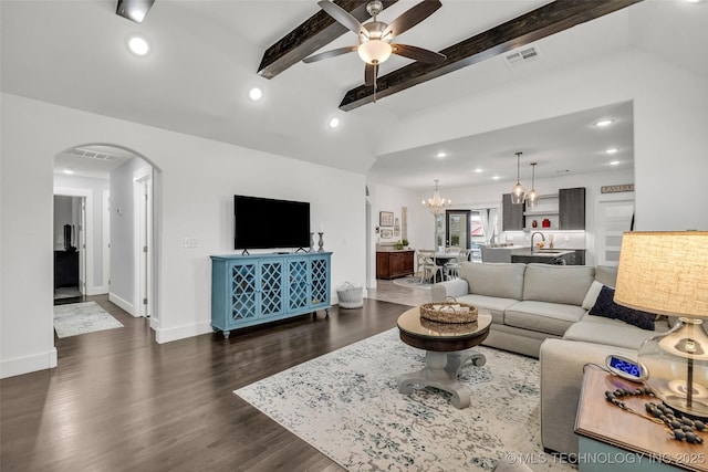 2621 S Catalayah Ln, Claremore, OK 74019 - living area featuring arched walkways, ceiling fan, recessed lighting, a chandelier, and dark wood-style floors