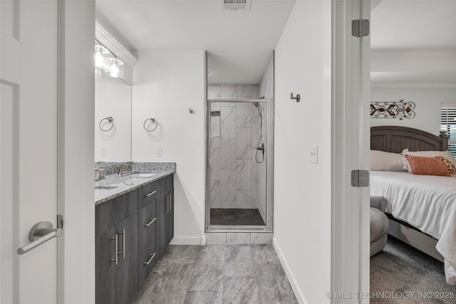 2621 S Catalayah Ln, Claremore, OK 74019 - bathroom with ensuite bathroom, marble finish flooring, a shower stall, baseboards, and double vanity