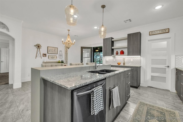 2621 S Catalayah Ln, Claremore, OK 74019 - kitchen featuring dishwasher, a sink, open shelves, an island with sink, and backsplash