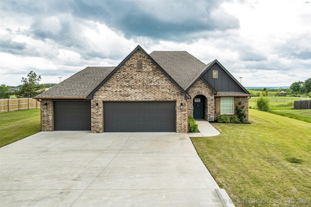 2621 S Catalayah Ln, Claremore, OK 74019 - view of front of property with roof with shingles, a garage, driveway, brick siding, and board and batten siding