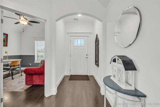 2621 S Catalayah Ln, Claremore, OK 74019 - entryway featuring wood finished floors, a ceiling fan, crown molding, arched walkways, and lofted ceiling