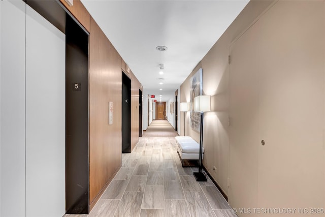 hallway featuring elevator