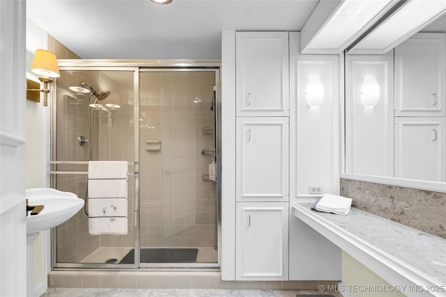 full bathroom with a shower stall