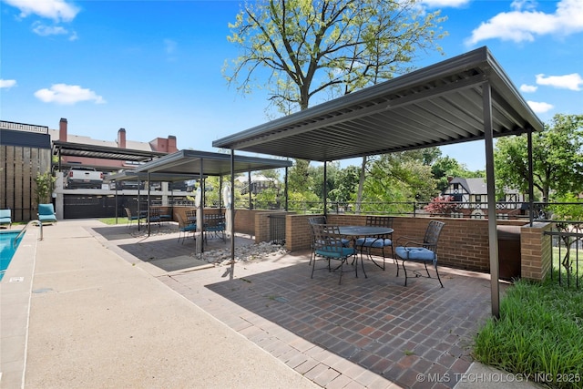 view of patio / terrace with outdoor dining area and fence