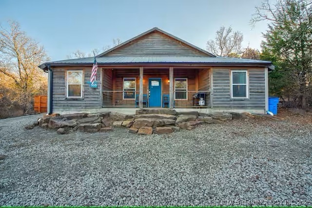 555 Williams Dr, Eufaula, OK 74432 - view of front facade with covered porch and metal roof