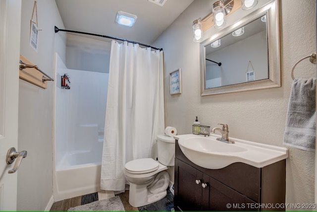 555 Williams Dr, Eufaula, OK 74432 - bathroom with toilet, vanity, shower / bath combo with shower curtain, and wood finished floors