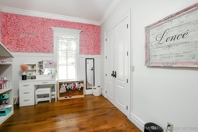 interior space featuring crown molding and dark wood finished floors