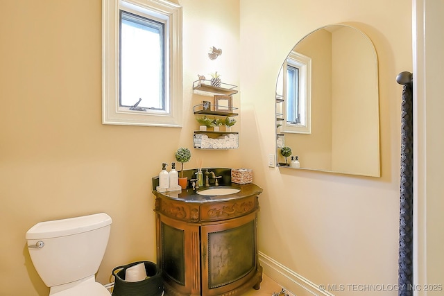 half bath with toilet and vanity