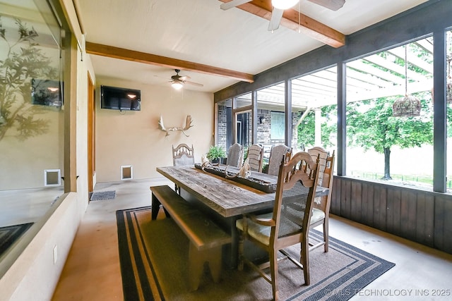 dining room with ceiling fan and beam ceiling