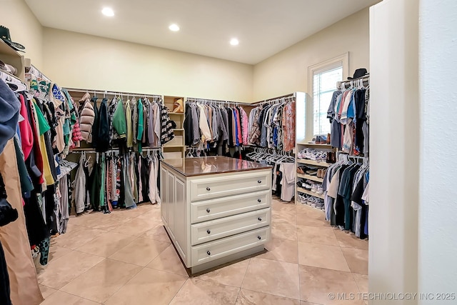walk in closet featuring light tile patterned floors