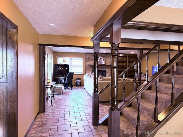 2902 Hilltop Ave, Muskogee, OK 74403 - stairway featuring a textured ceiling and stone tile floors