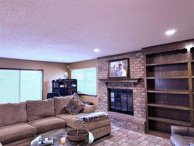 2902 Hilltop Ave, Muskogee, OK 74403 - living room with a brick fireplace, brick patterned flooring, recessed lighting, and a textured ceiling