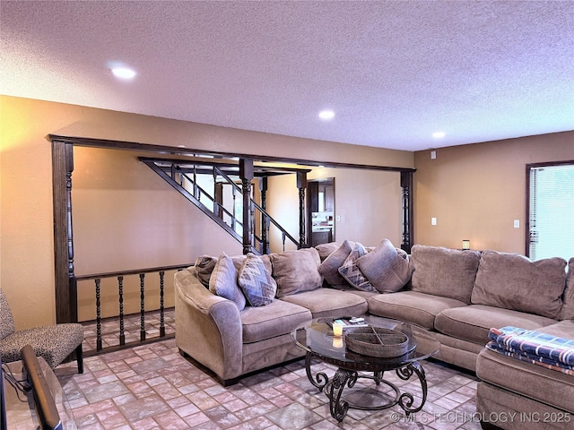 2902 Hilltop Ave, Muskogee, OK 74403 - living room with recessed lighting, brick patterned flooring, a textured ceiling, and stairs