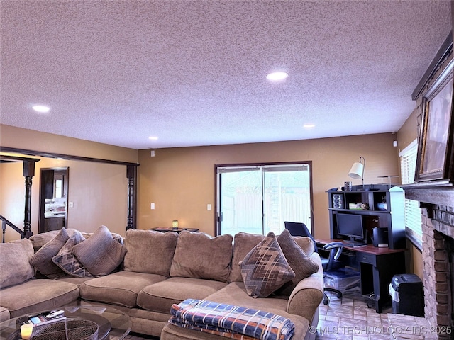 2902 Hilltop Ave, Muskogee, OK 74403 - living area featuring recessed lighting, a textured ceiling, and a fireplace