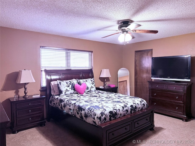 2902 Hilltop Ave, Muskogee, OK 74403 - bedroom featuring light colored carpet, a textured ceiling, and a ceiling fan