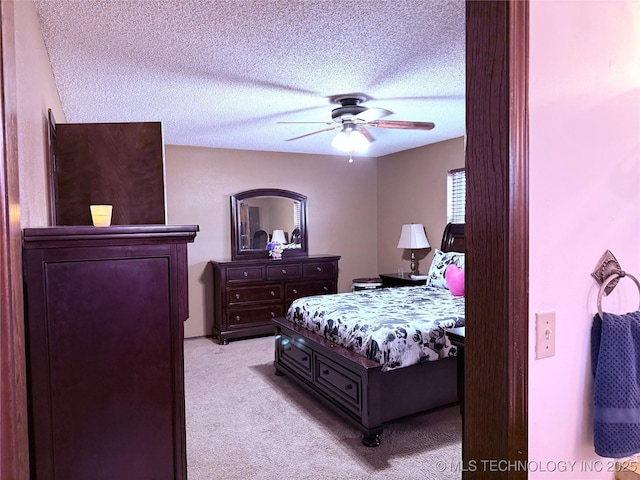 2902 Hilltop Ave, Muskogee, OK 74403 - bedroom with light carpet, a textured ceiling, and ceiling fan